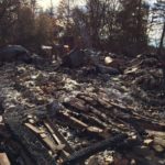 Debris laying in a field after the Camp Fire in Paradise, CA